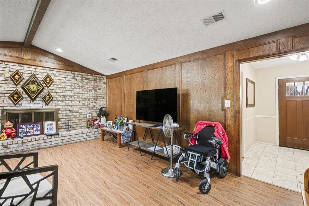 5009 River Ridge Road Arlington, TX 76017 - Photo 14 of 28 a living room with furniture and a flat screen tv