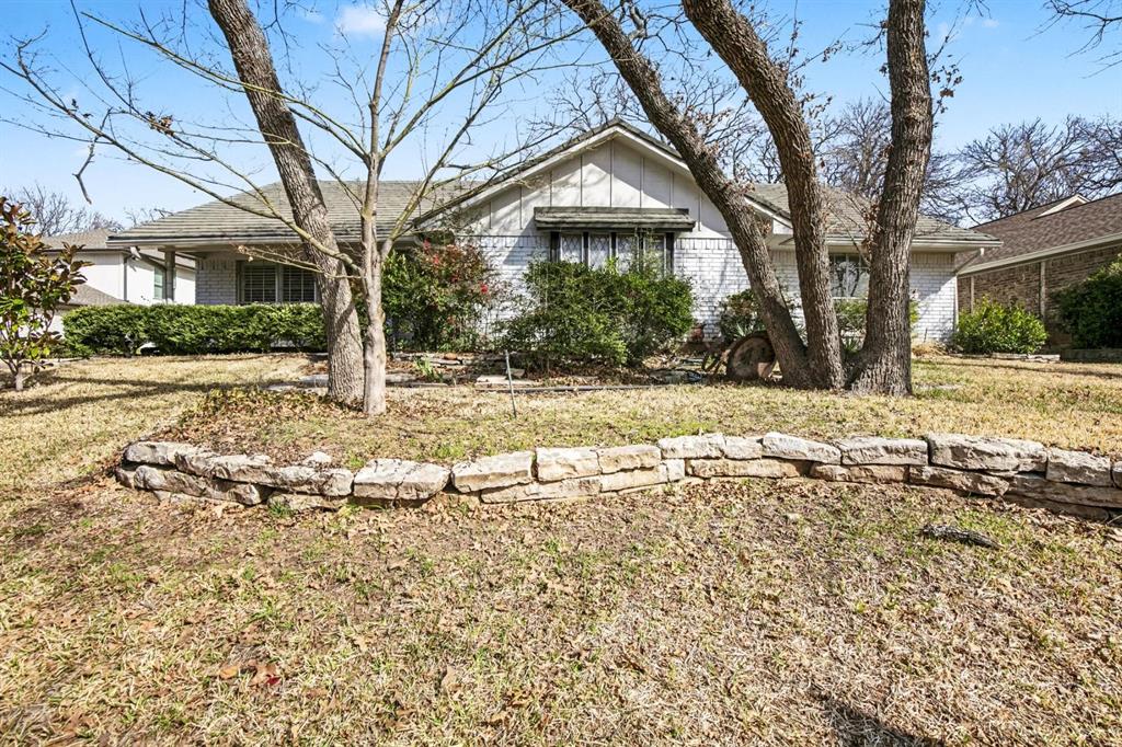 5009 River Ridge Road Arlington, TX 76017 - Photo 2 of 28 a view of a house with a yard covered in snow