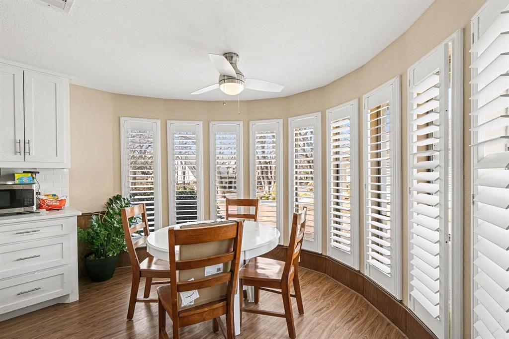 5009 River Ridge Road Arlington, TX 76017 - Photo 8 of 28 a view of a dining room with furniture window and wooden floor