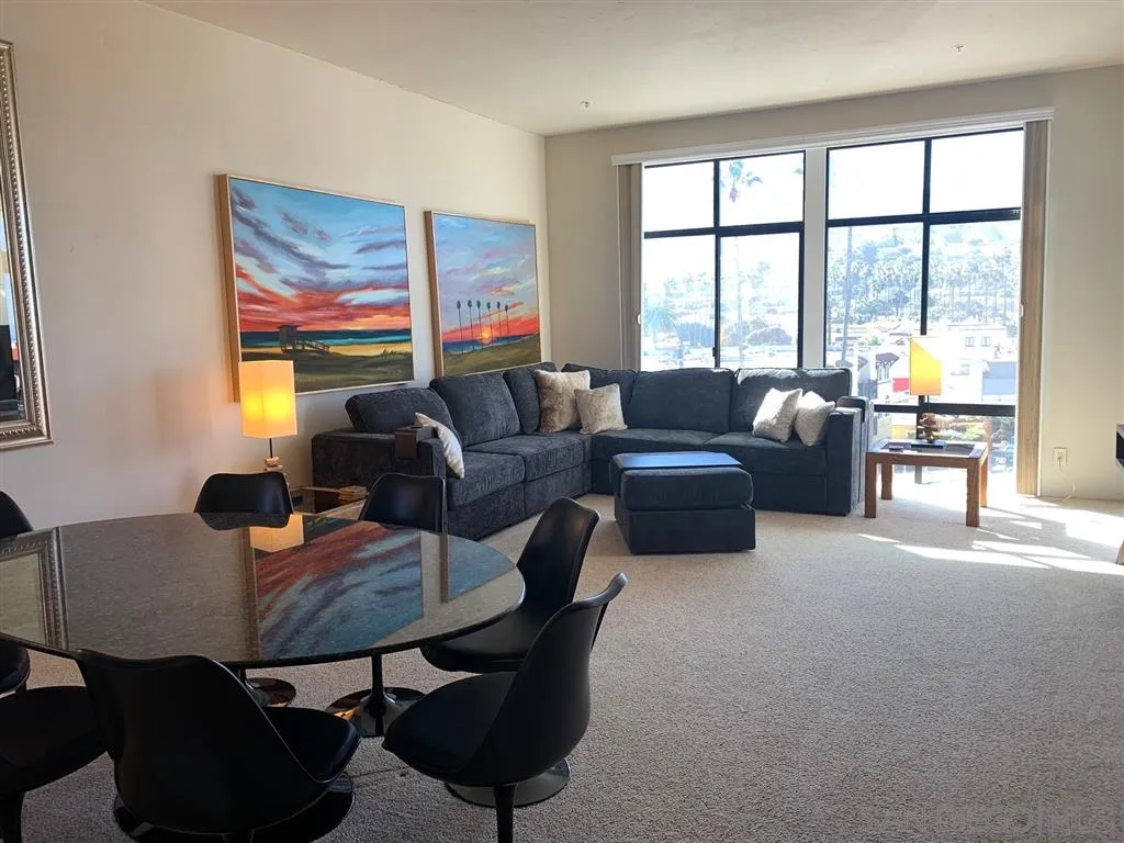 2130 Vallecitos, Unit 441 La Jolla, CA 92037 - Photo 12 of 25 a living room with furniture and a large window
