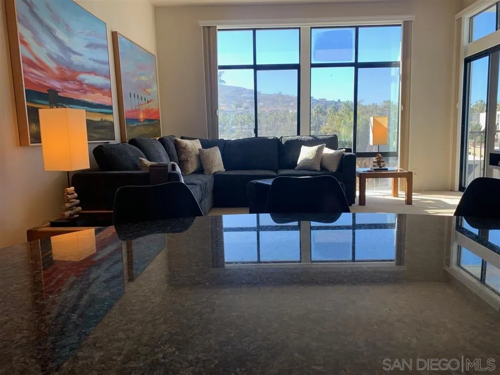 2130 Vallecitos, Unit 441 La Jolla, CA 92037 - Photo 13 of 25 a living room with furniture and a floor to ceiling window