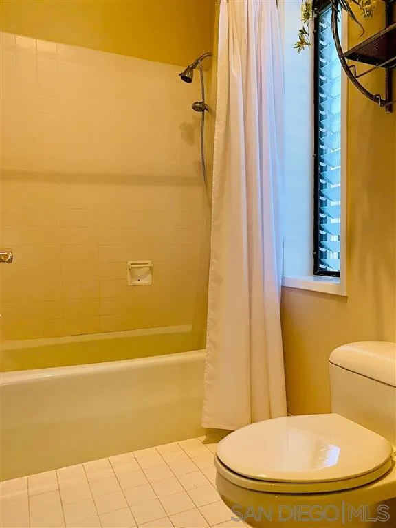 2130 Vallecitos, Unit 441 La Jolla, CA 92037 - Photo 24 of 25 a bathroom with a toilet and a shower