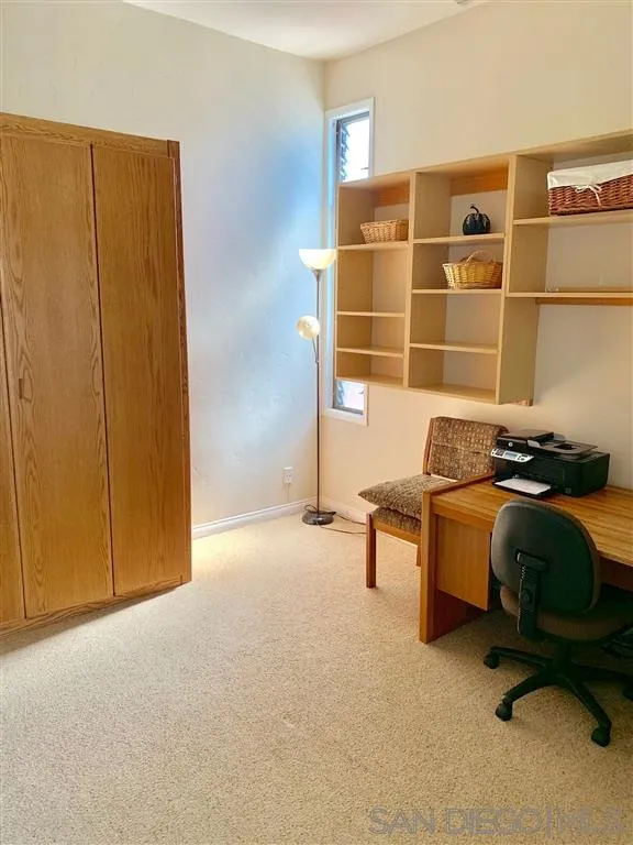 2130 Vallecitos, Unit 441 La Jolla, CA 92037 - Photo 8 of 25 a room with a chair and gym equipment