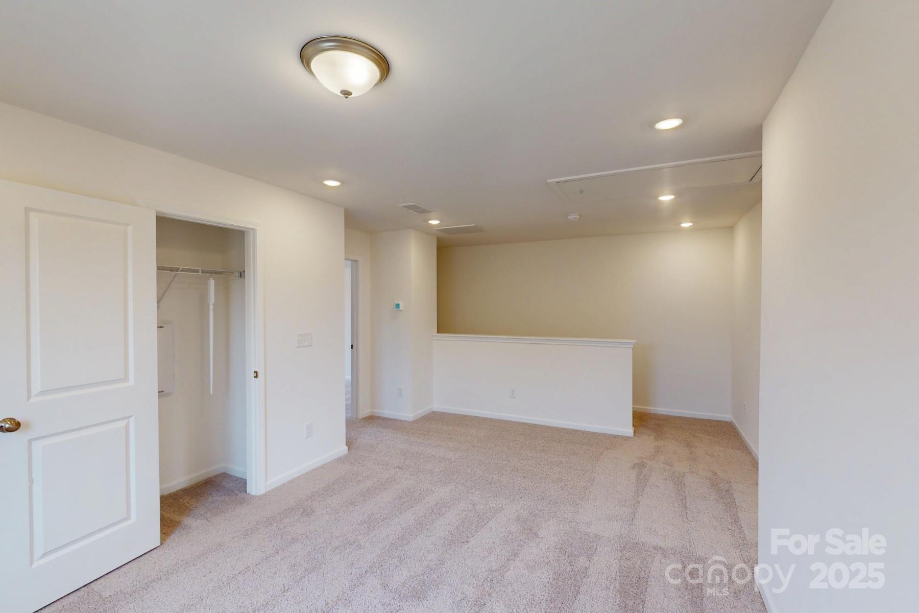 1030 Overbrook Place Wingate, NC 28174 - Photo 11 of 21 an empty room with closet and wooden floor