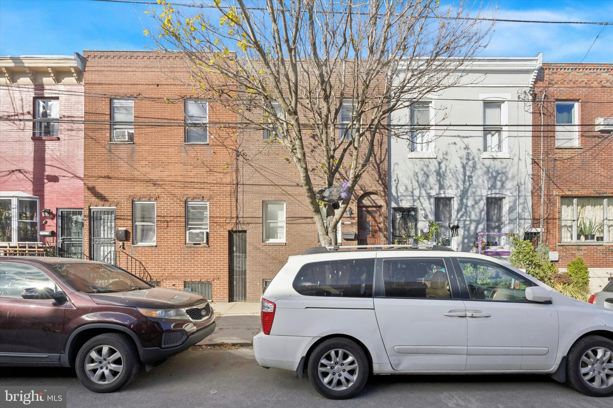 a view of a car parked in front of a house