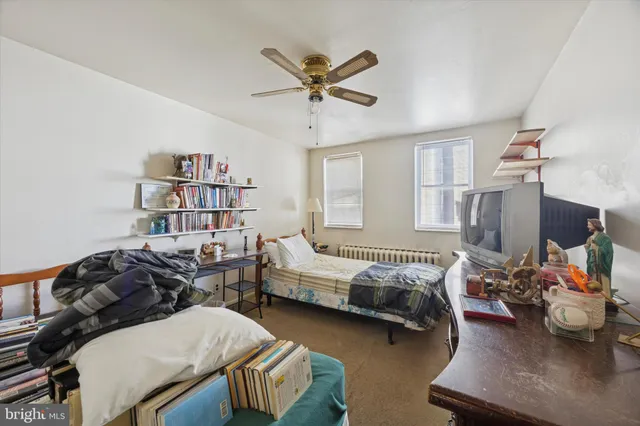 a bedroom with furniture and a window