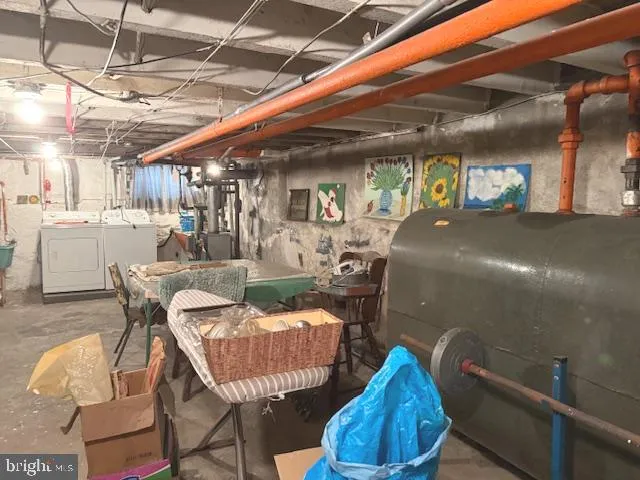 a dining room with furniture and a chandelier