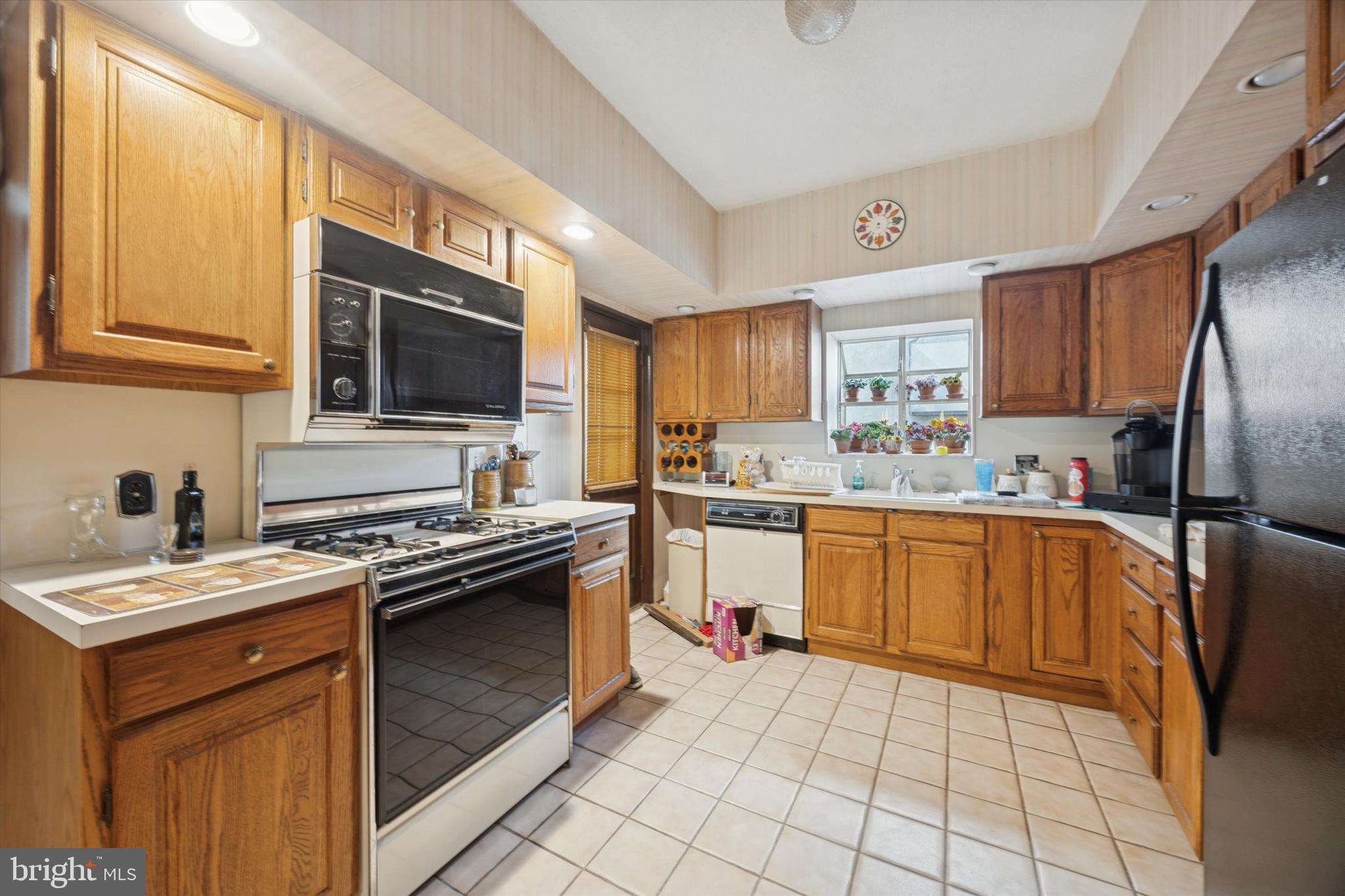 2020 South 9th Street Philadelphia, PA 19148 - Photo 7 of 19 a kitchen with a sink stove and refrigerator
