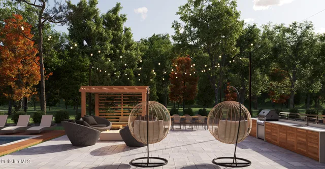 a view of a swimming pool and sitting area