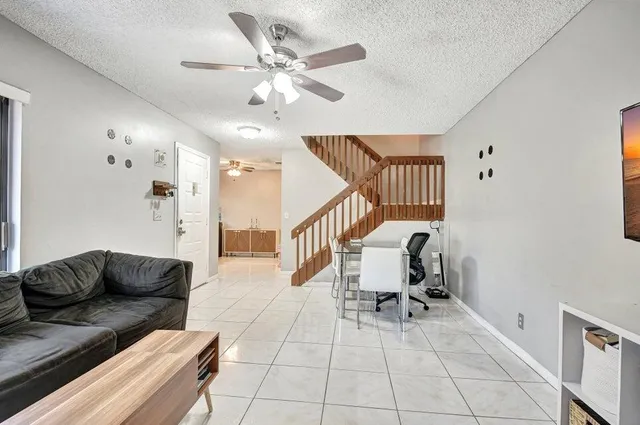 a living room with furniture a dining table and chairs