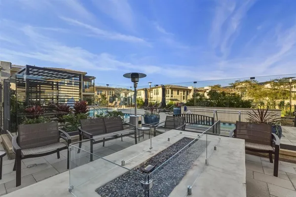 a terrace with outdoor seating and city view