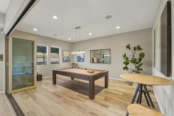 a living room with furniture a table and a potted plant