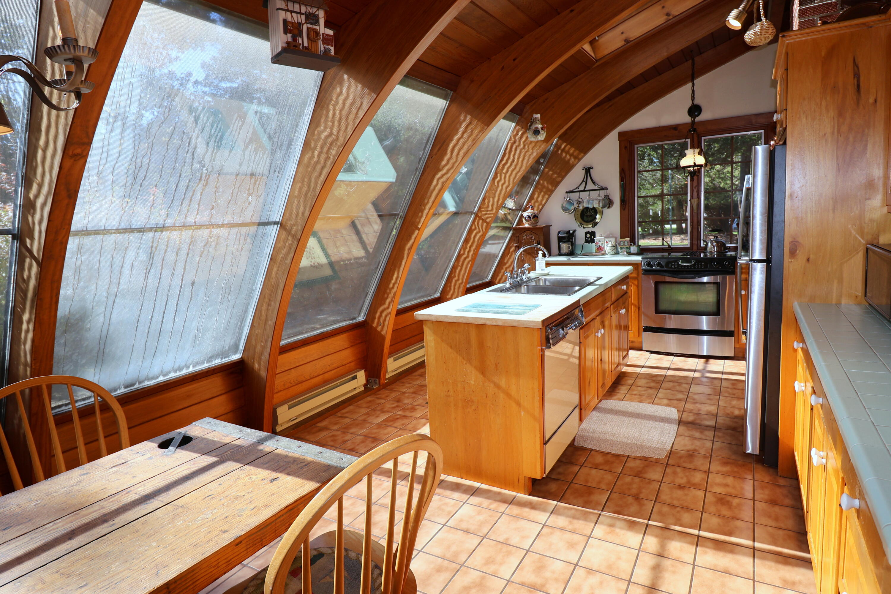 42 Robbins Circle Dennis, MA 02638 - Photo 12 of 46 a view of a kitchen with a sink and cabinets