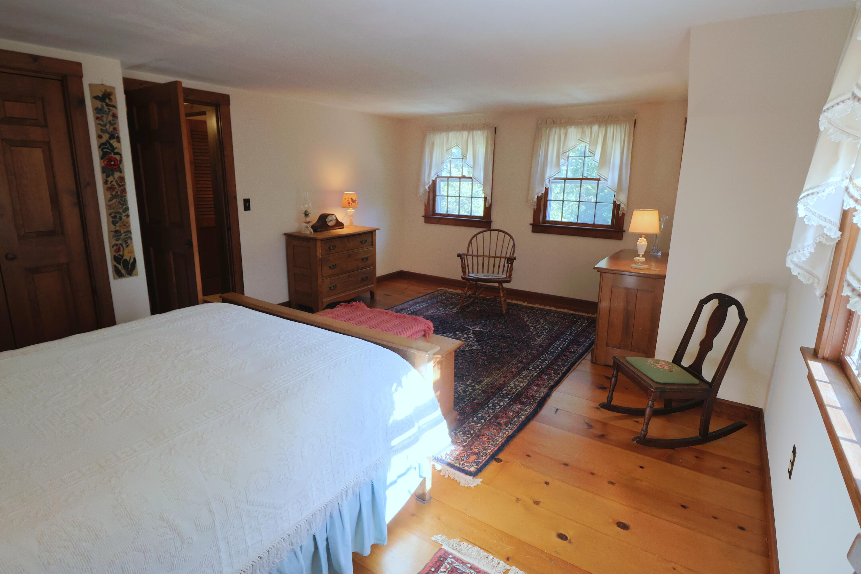 42 Robbins Circle Dennis, MA 02638 - Photo 32 of 46 a bed room with a bed chair and a large mirror