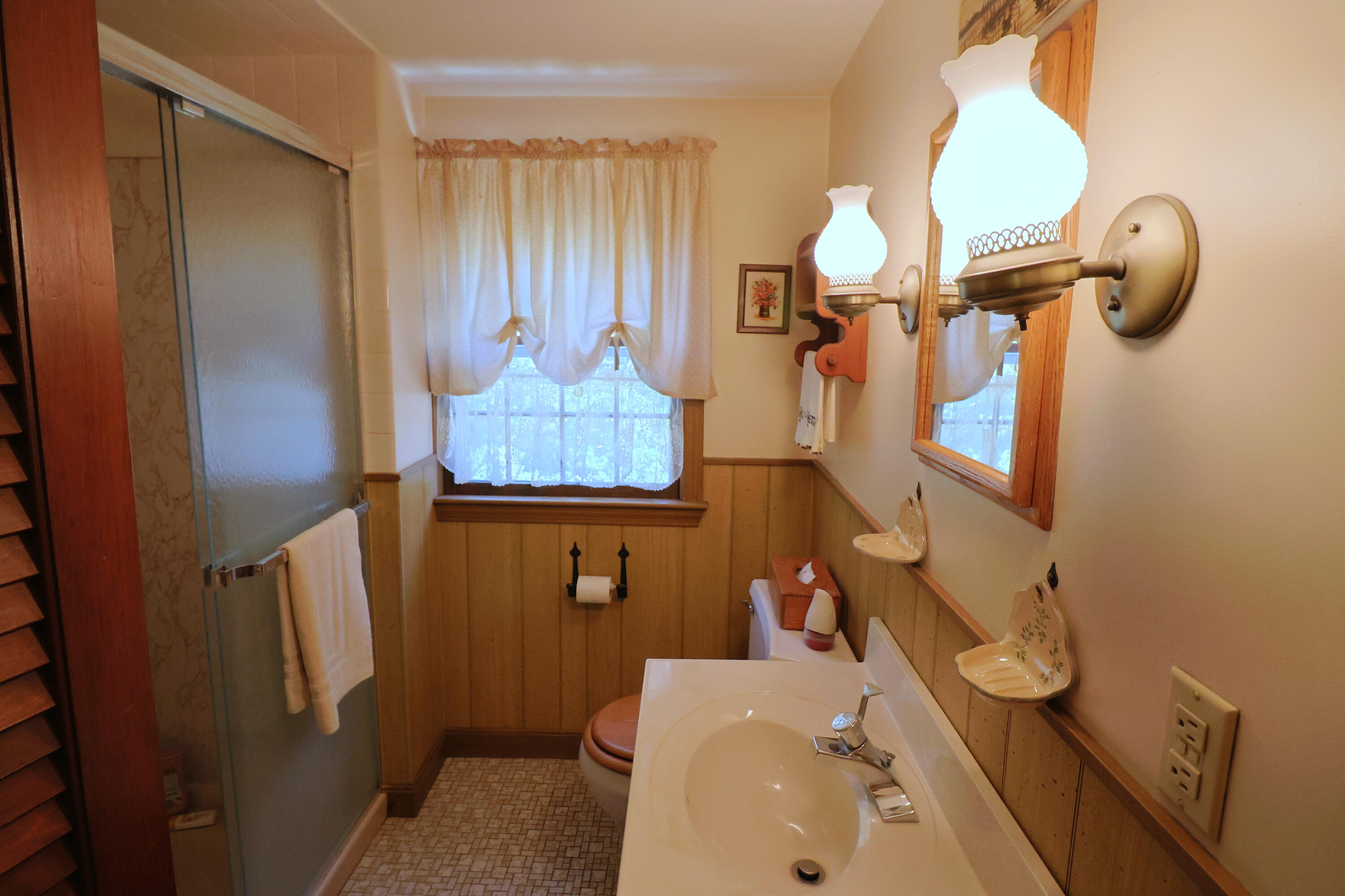 42 Robbins Circle Dennis, MA 02638 - Photo 35 of 46 a bathroom with a sink a toilet and shower curtain