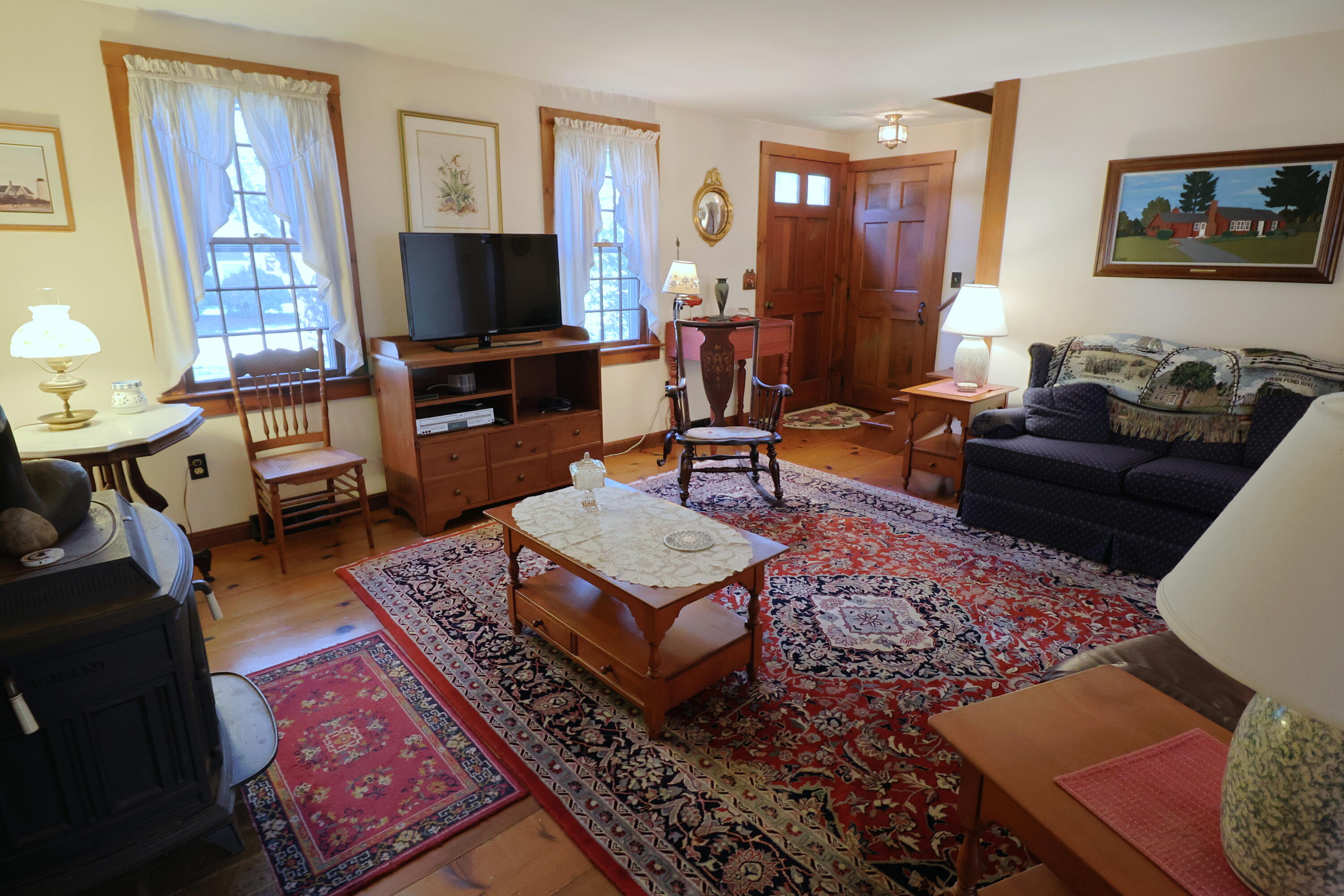 42 Robbins Circle Dennis, MA 02638 - Photo 4 of 46 a living room with furniture and a flat screen tv