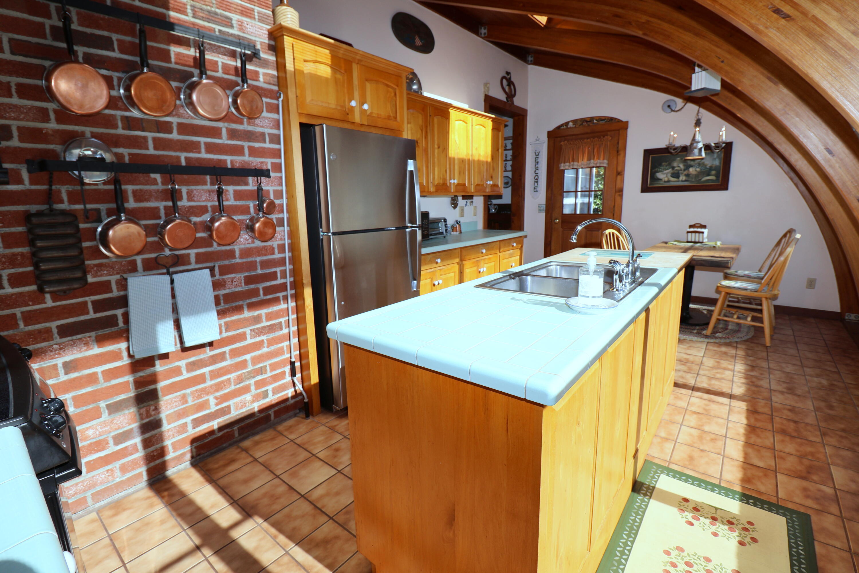 42 Robbins Circle Dennis, MA 02638 - Photo 10 of 46 a view of a kitchen with a sink and refrigerator