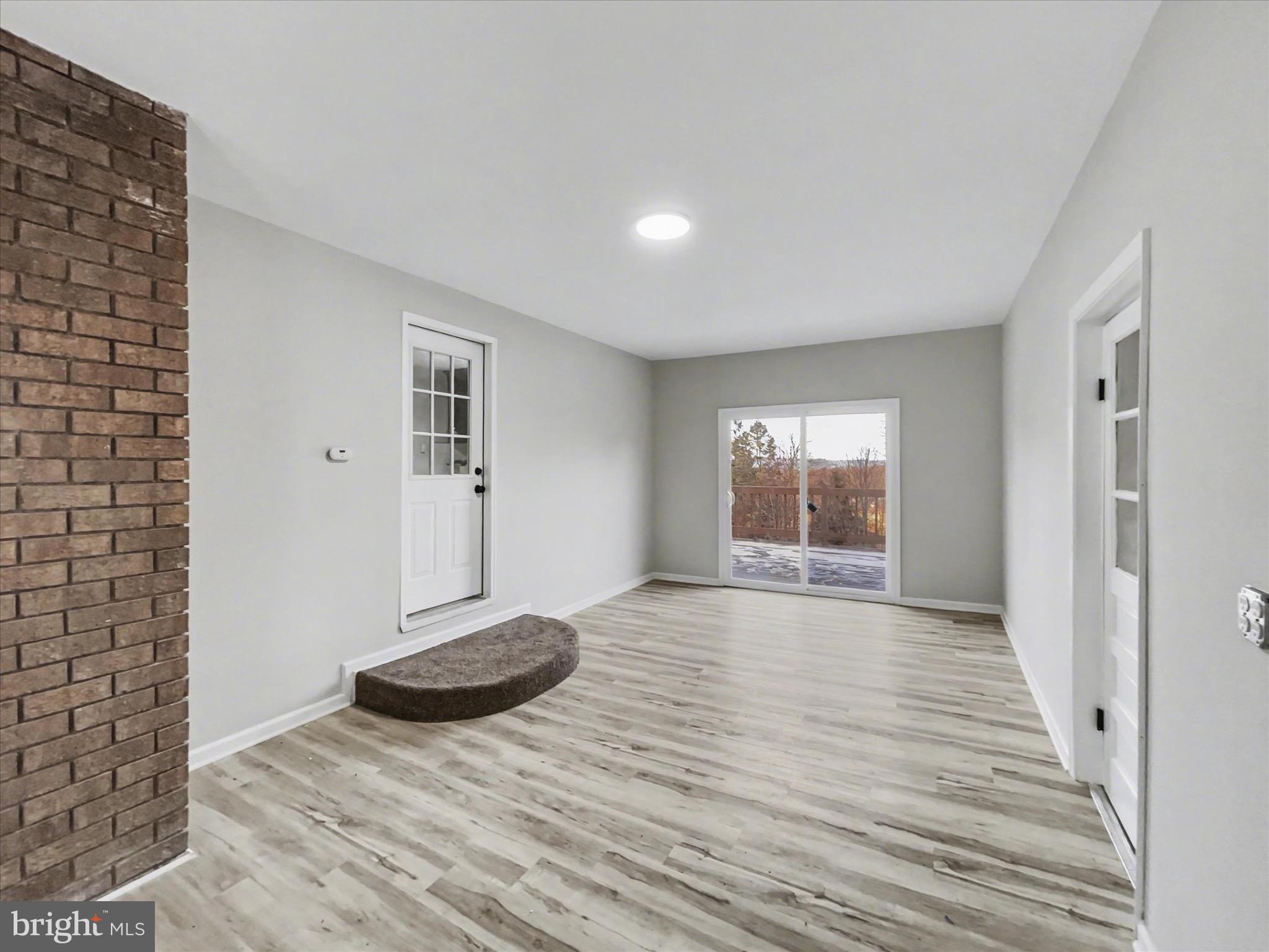2206 Ridge Road Glenville, PA 17329 - Photo 11 of 23 a view of empty room with wooden floor and fan