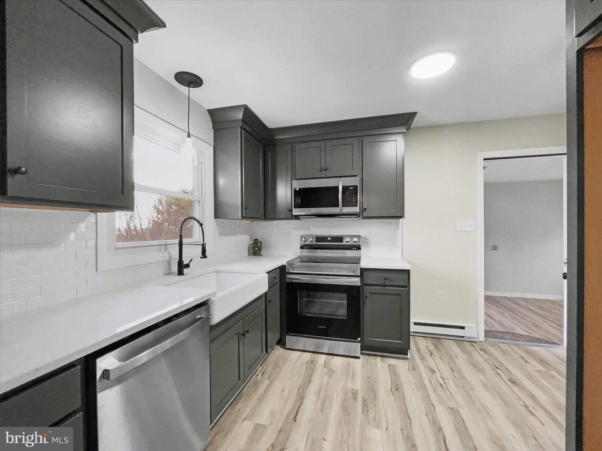 2206 Ridge Road Glenville, PA 17329 - Photo 8 of 23 a kitchen with stainless steel appliances a sink stove and refrigerator