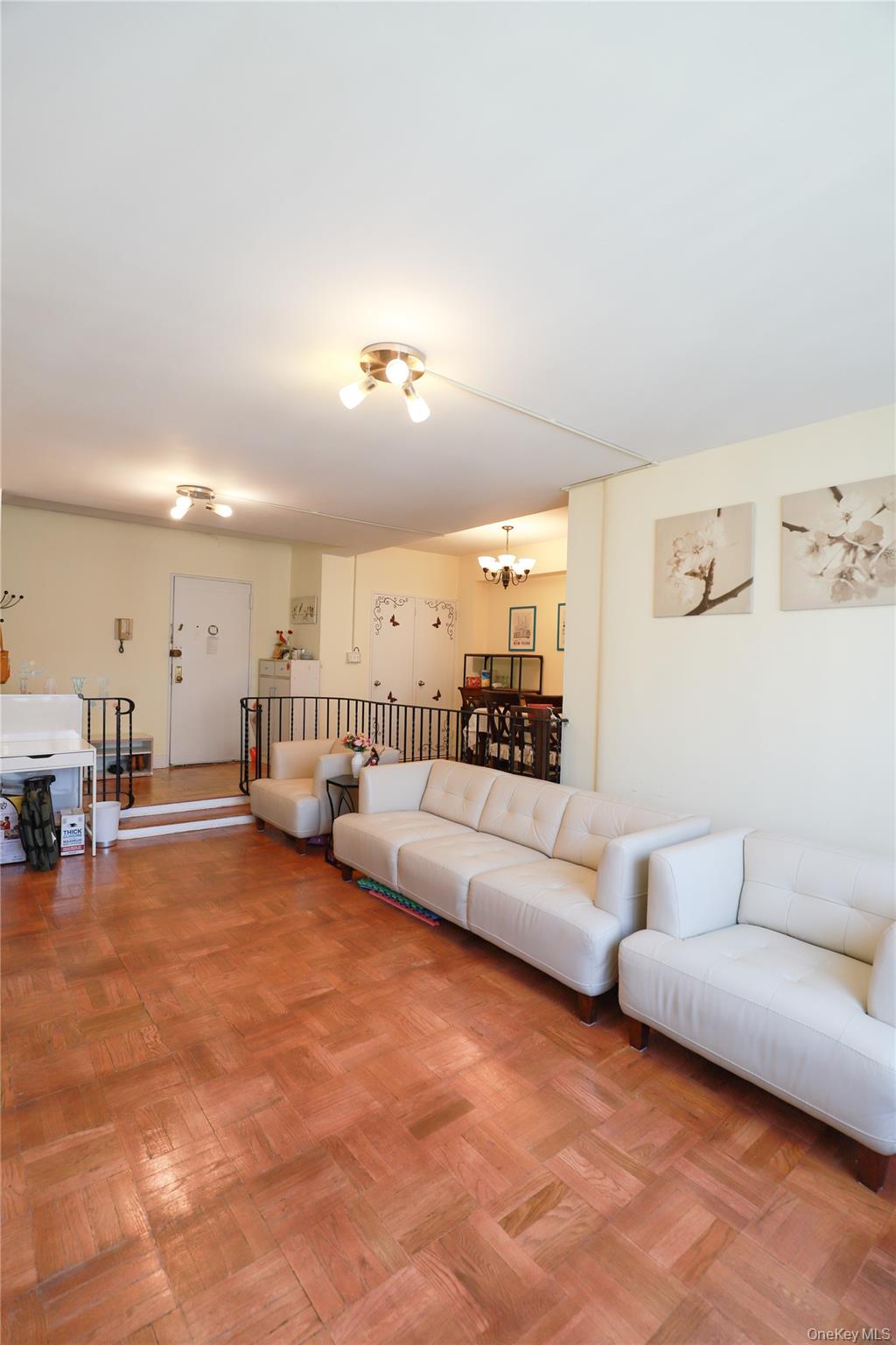 98-25 64th Road, Unit 6F Queens, NY 11374 - Photo 10 of 12 Parquet wood-finish flooring throughout the main living area