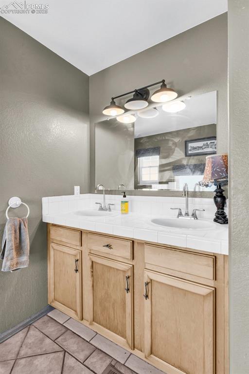 770 Cedar Hills Road Penrose, CO 81240 - Photo 18 of 49 a bathroom with a sink vanity and mirror