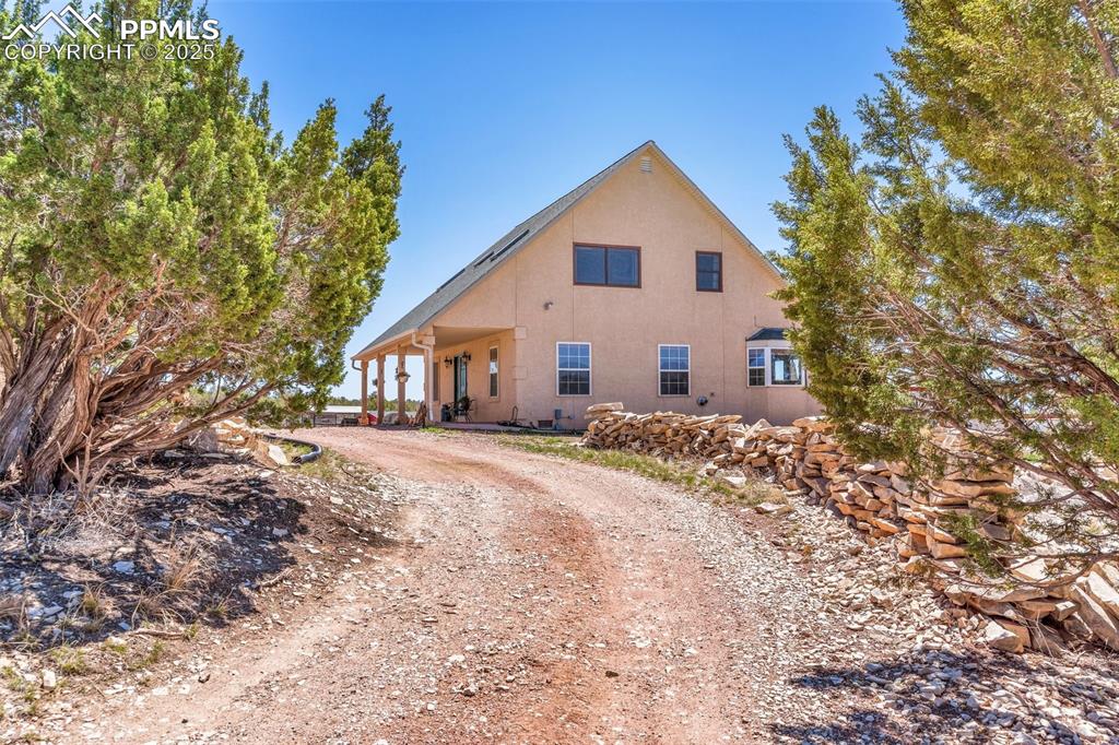 770 Cedar Hills Road Penrose, CO 81240 - Photo 2 of 49 a view of a house with a yard