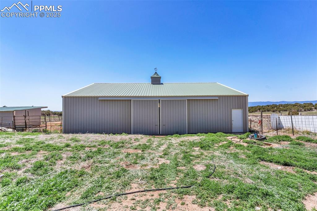 770 Cedar Hills Road Penrose, CO 81240 - Photo 38 of 49 a yellow house with a yard