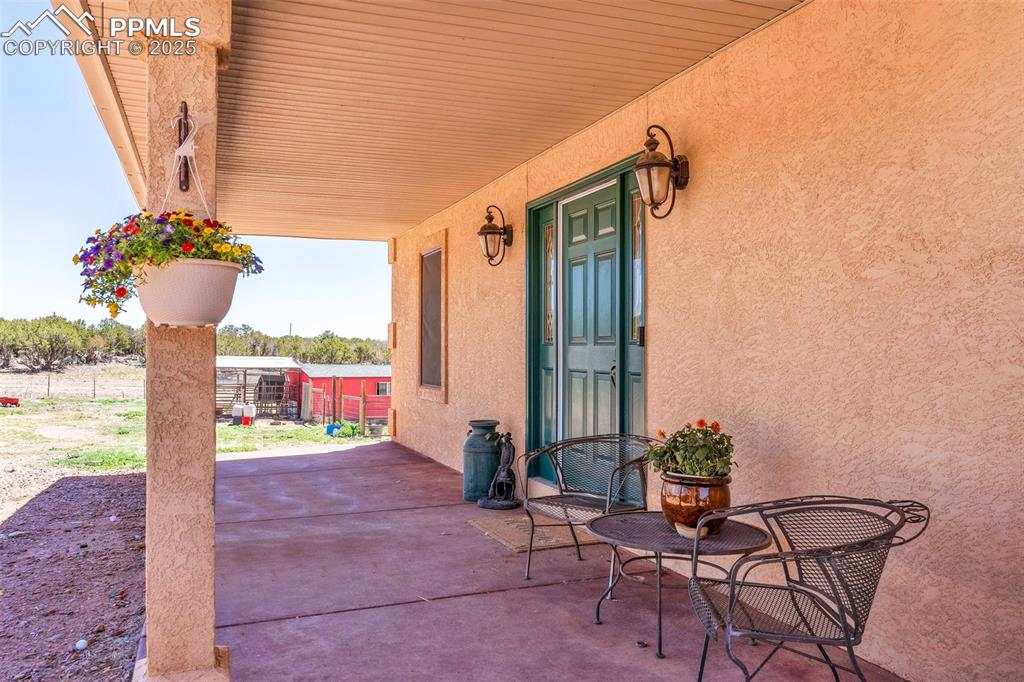 770 Cedar Hills Road Penrose, CO 81240 - Photo 4 of 49 a front view of a house with outdoor seating