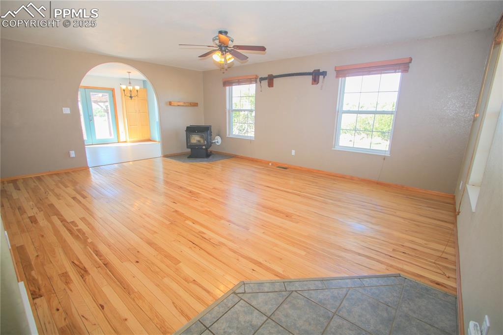 770 Cedar Hills Road Penrose, CO 81240 - Photo 6 of 49 a view of a room with wooden floor and windows