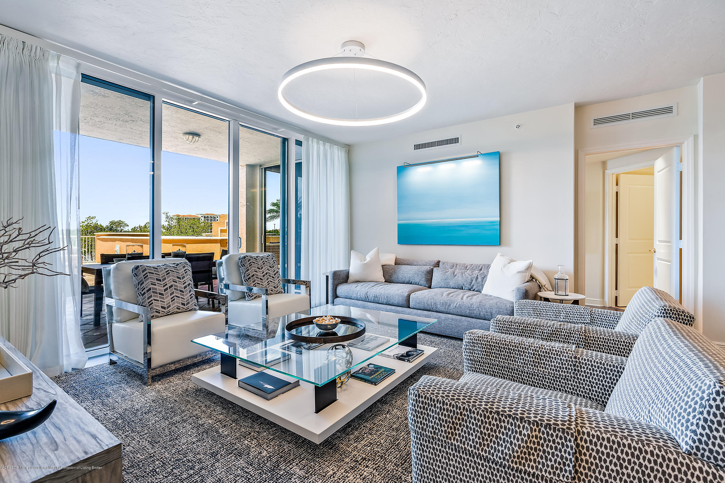 700 Highway 1, Unit 102 Jupiter, FL 33477 - Photo 1 of 36 a living room with furniture and a large window