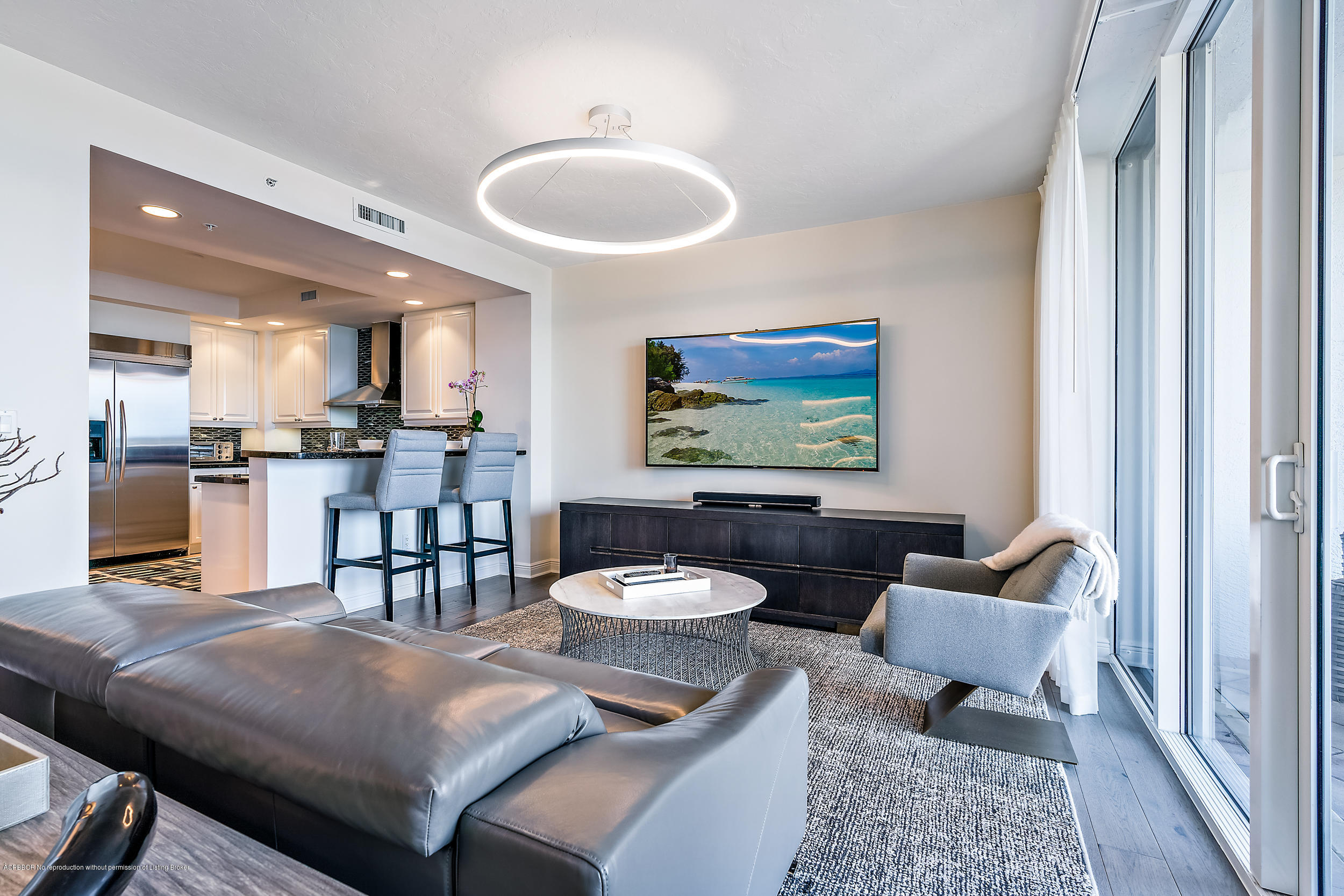 700 Highway 1, Unit 102 Jupiter, FL 33477 - Photo 12 of 36 a living room with furniture and a view of kitchen