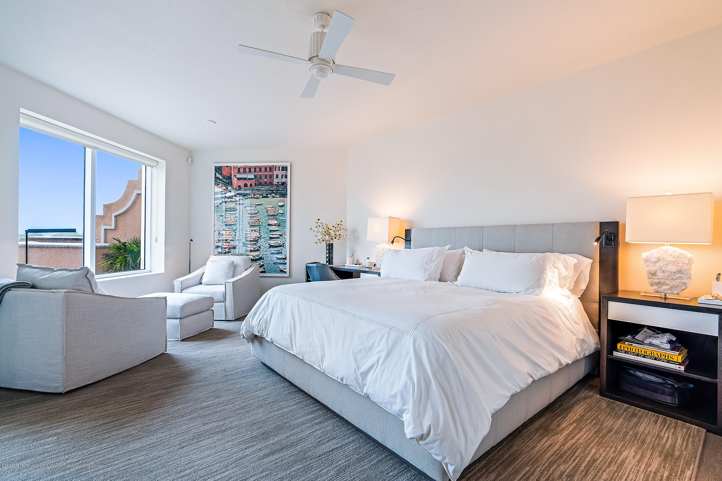 700 Highway 1, Unit 102 Jupiter, FL 33477 - Photo 16 of 36 a bedroom with a bed and a couch