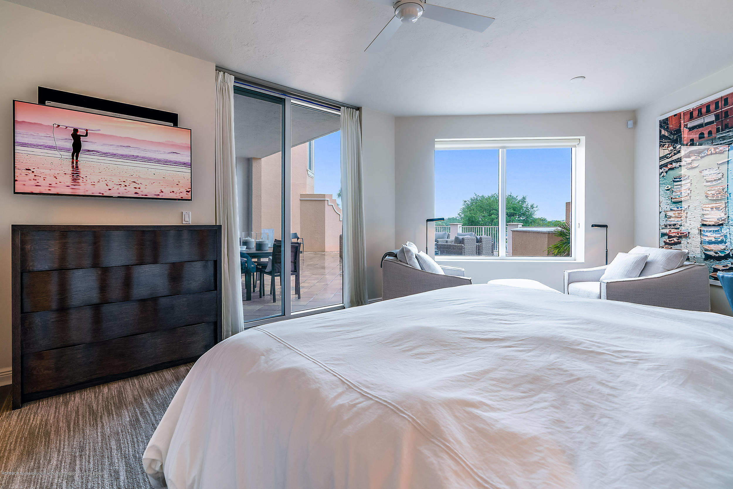 700 Highway 1, Unit 102 Jupiter, FL 33477 - Photo 18 of 36 a bedroom with a bed and a large window