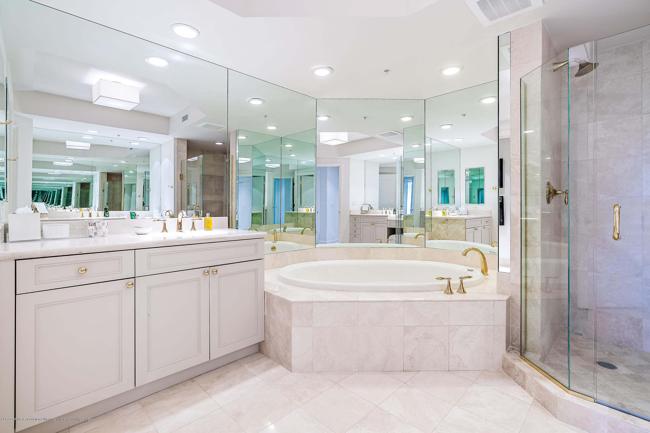 700 Highway 1, Unit 102 Jupiter, FL 33477 - Photo 20 of 36 a bathroom with a large tub a sink shower and mirror