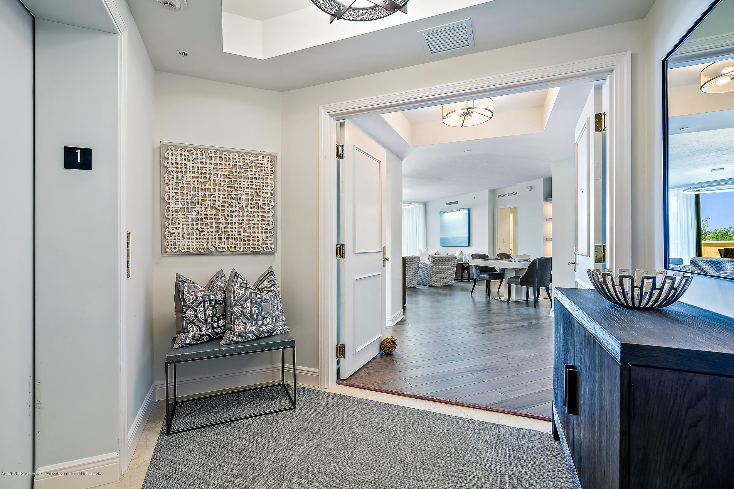 700 Highway 1, Unit 102 Jupiter, FL 33477 - Photo 3 of 36 a view of a livingroom with furniture and wooden floor