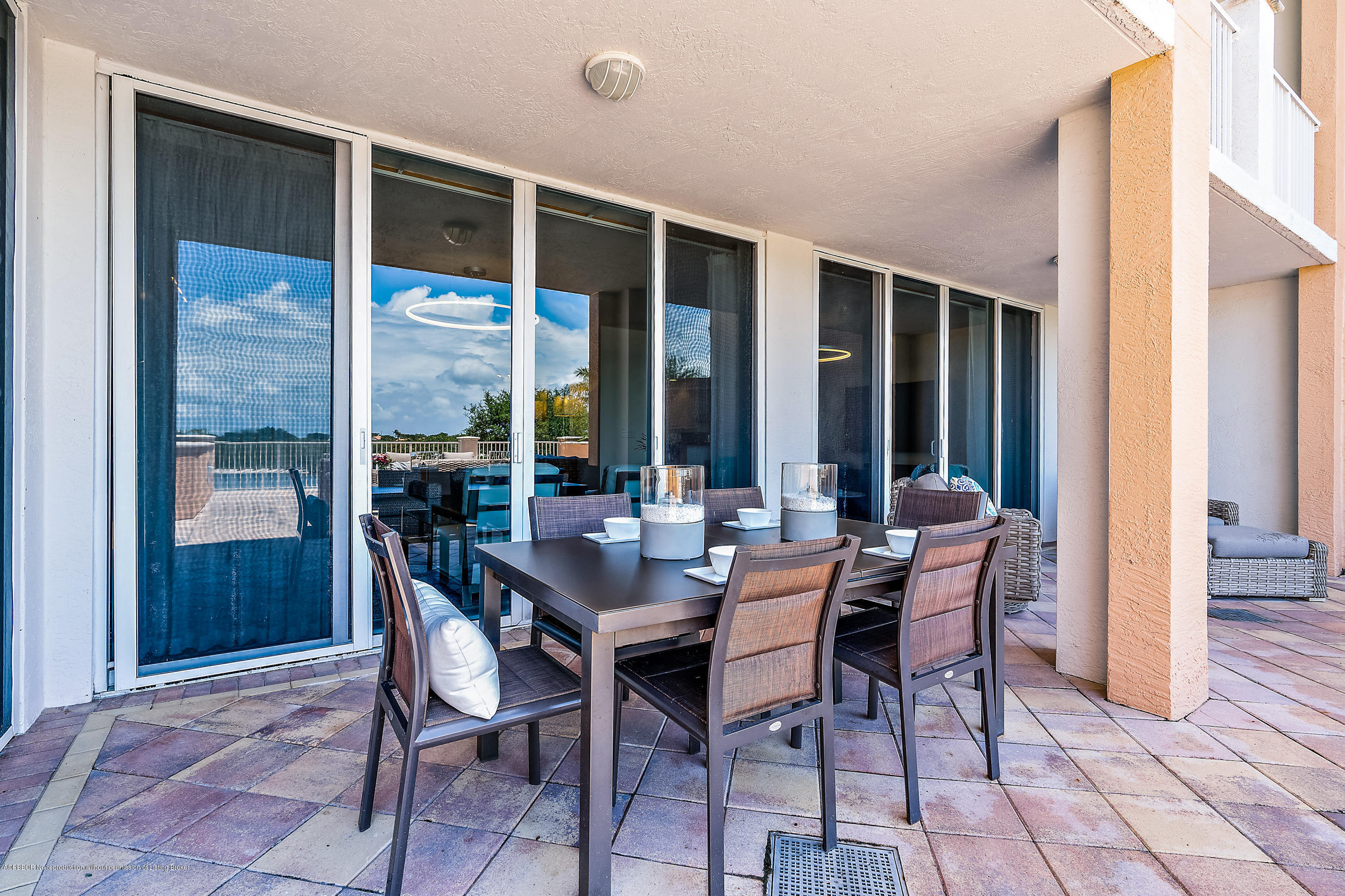 700 Highway 1, Unit 102 Jupiter, FL 33477 - Photo 21 of 36 a view of an outdoor dining space with furniture