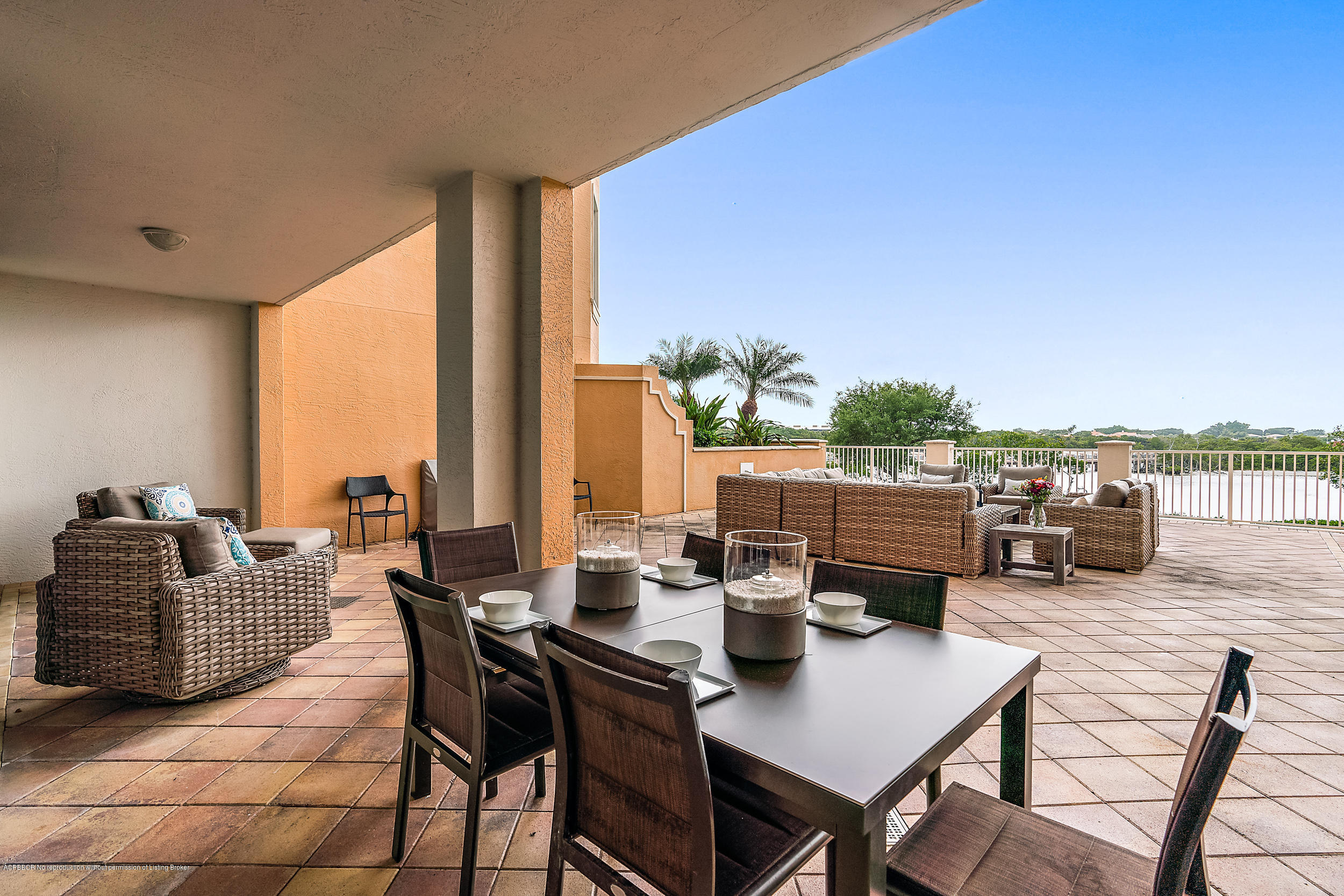 700 Highway 1, Unit 102 Jupiter, FL 33477 - Photo 23 of 36 a living room with furniture and a floor to ceiling window