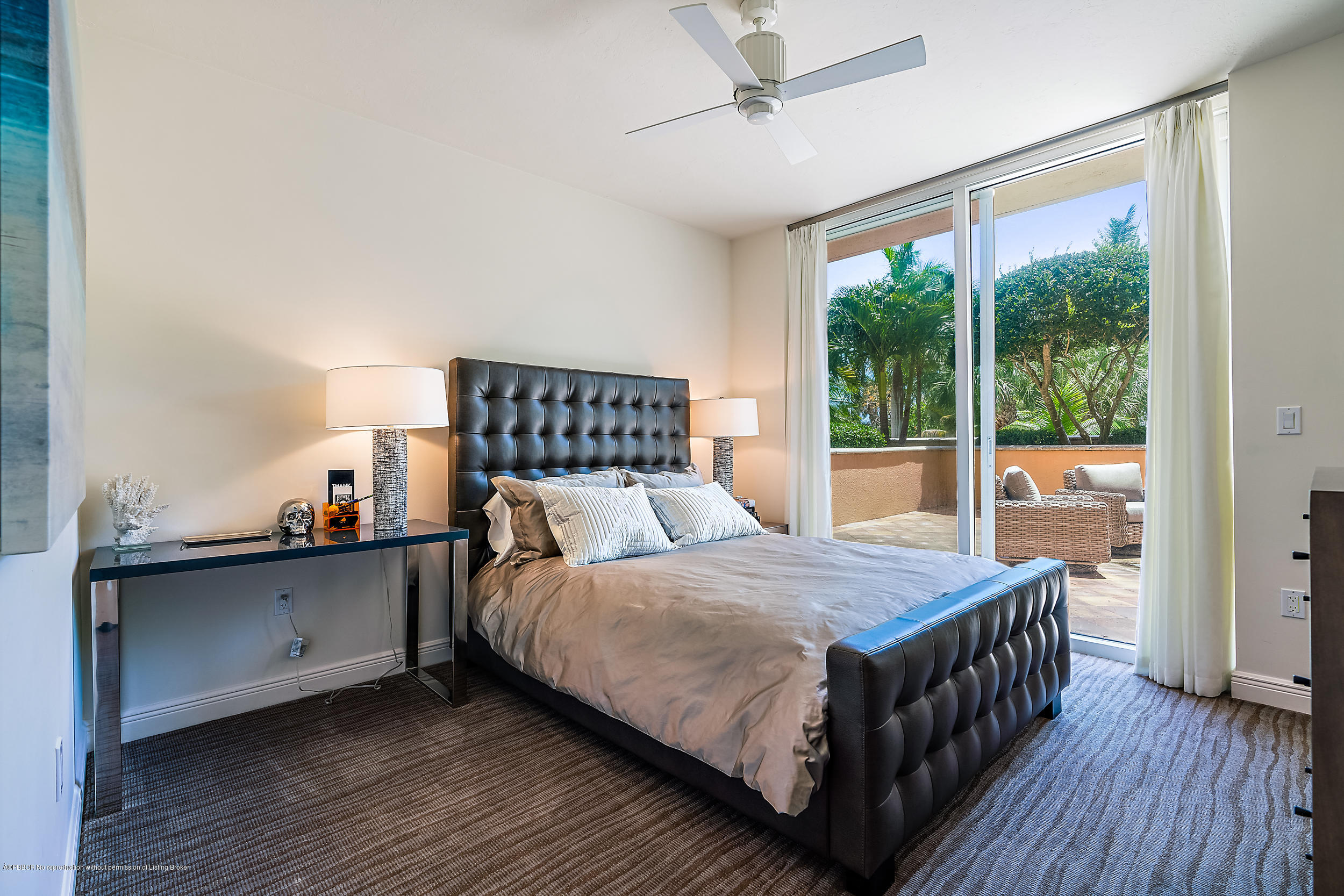 700 Highway 1, Unit 102 Jupiter, FL 33477 - Photo 24 of 36 a bedroom with a bed and a large window