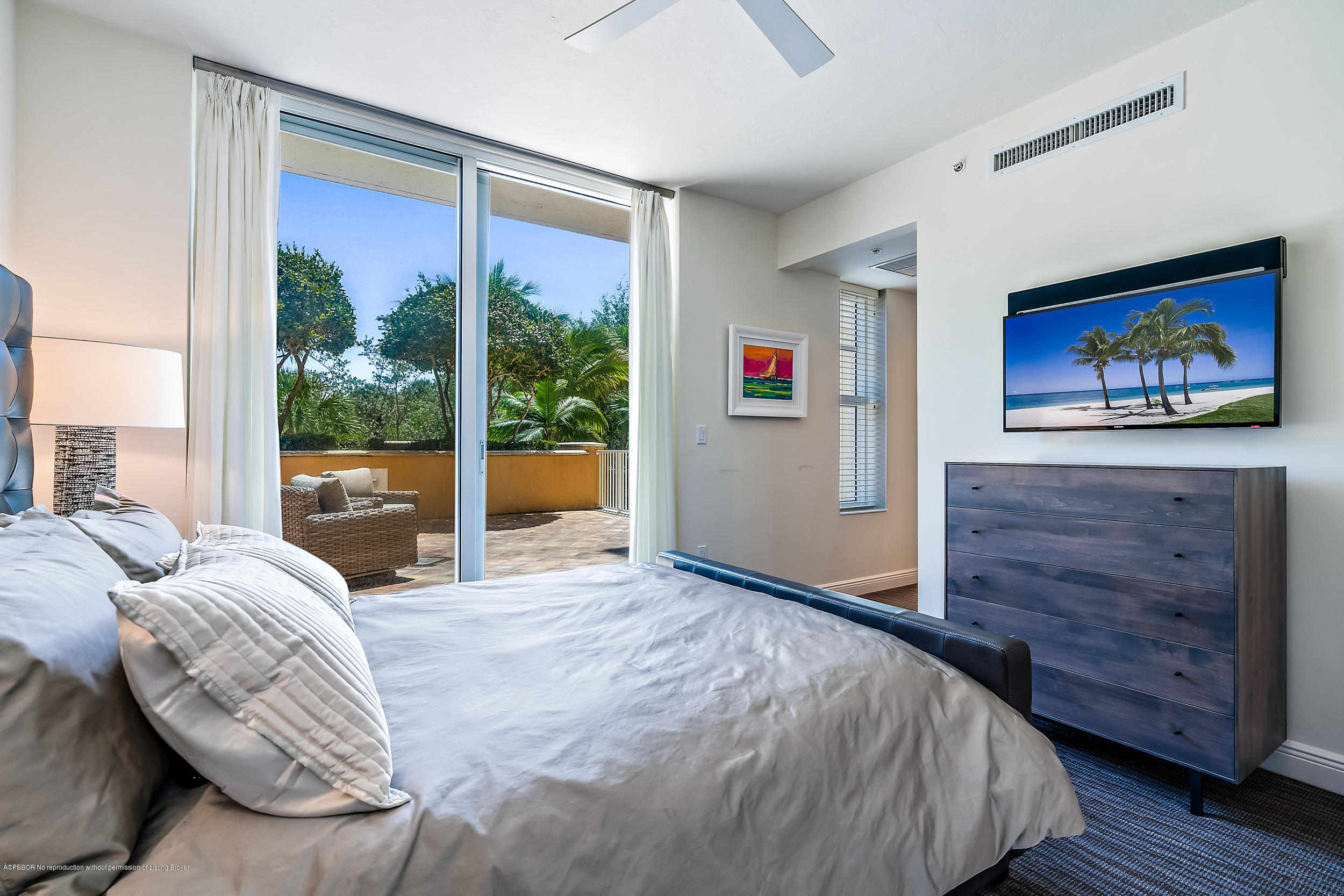 700 Highway 1, Unit 102 Jupiter, FL 33477 - Photo 25 of 36 a bedroom with a large bed and a window