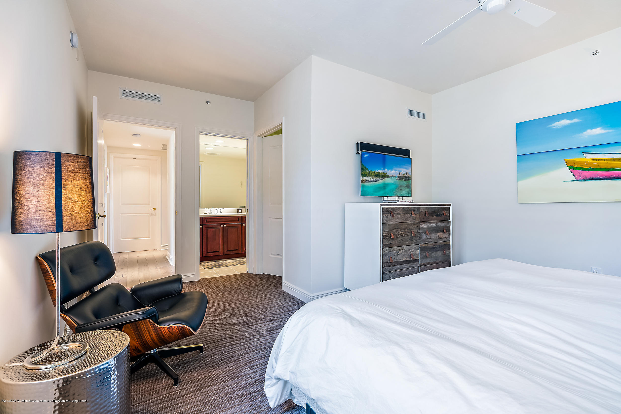 700 Highway 1, Unit 102 Jupiter, FL 33477 - Photo 30 of 36 a bedroom with a bed and furniture