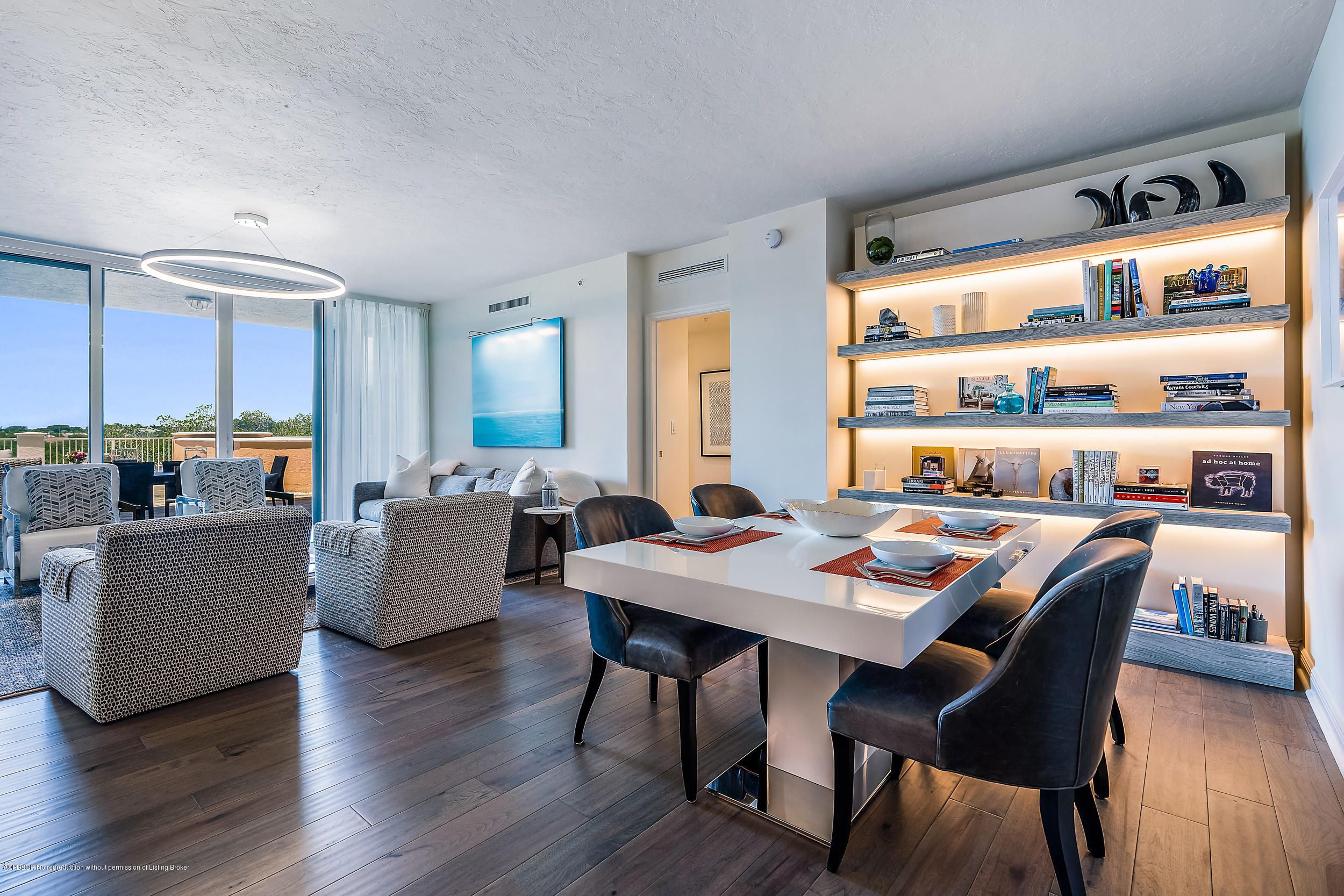 700 Highway 1, Unit 102 Jupiter, FL 33477 - Photo 4 of 36 a view of a dining room with furniture and wooden floor