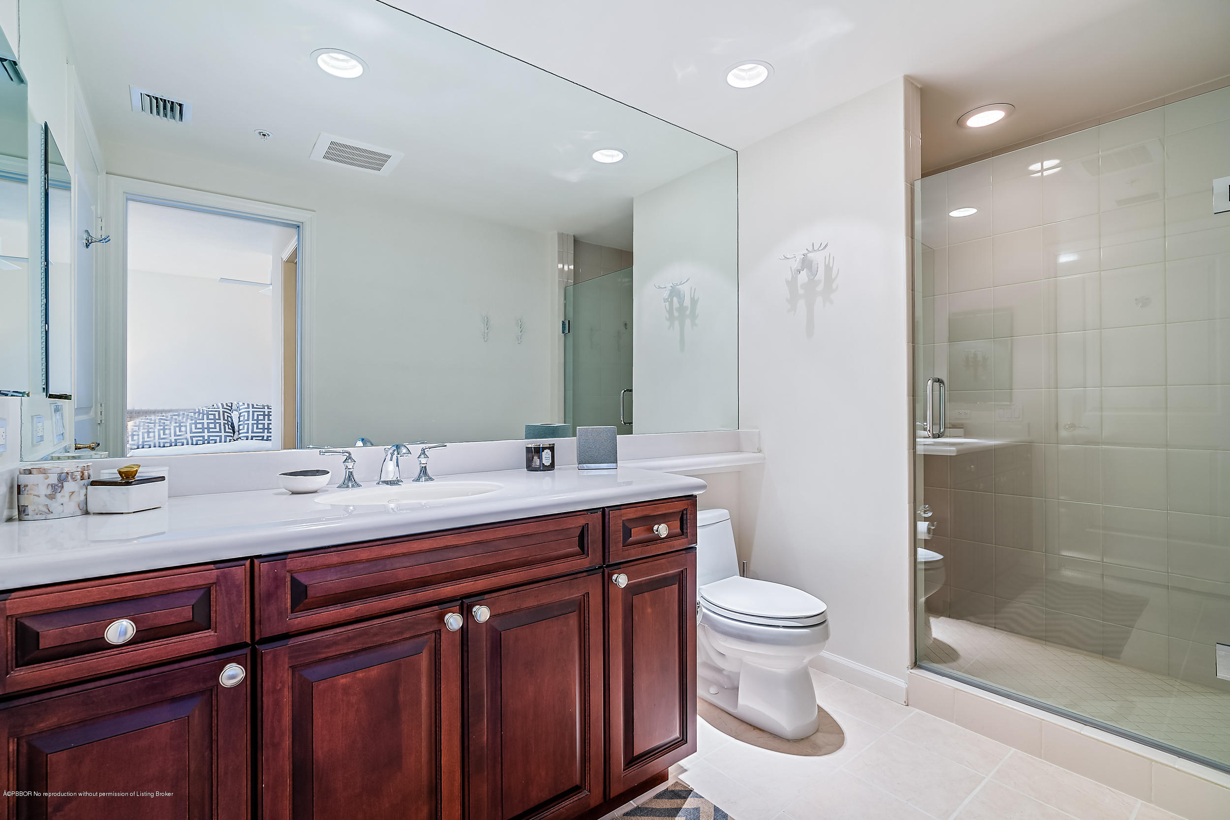 700 Highway 1, Unit 102 Jupiter, FL 33477 - Photo 31 of 36 a bathroom with a double vanity sink toilet and shower