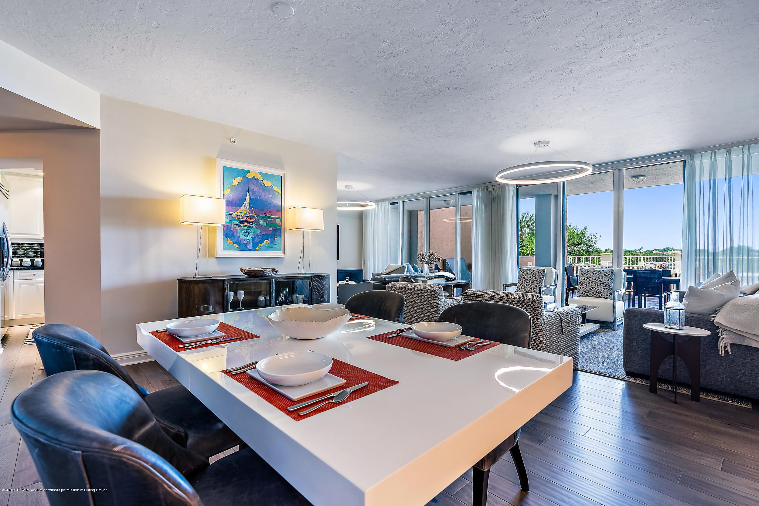 700 Highway 1, Unit 102 Jupiter, FL 33477 - Photo 5 of 36 a view of a dining room with furniture and wooden floor
