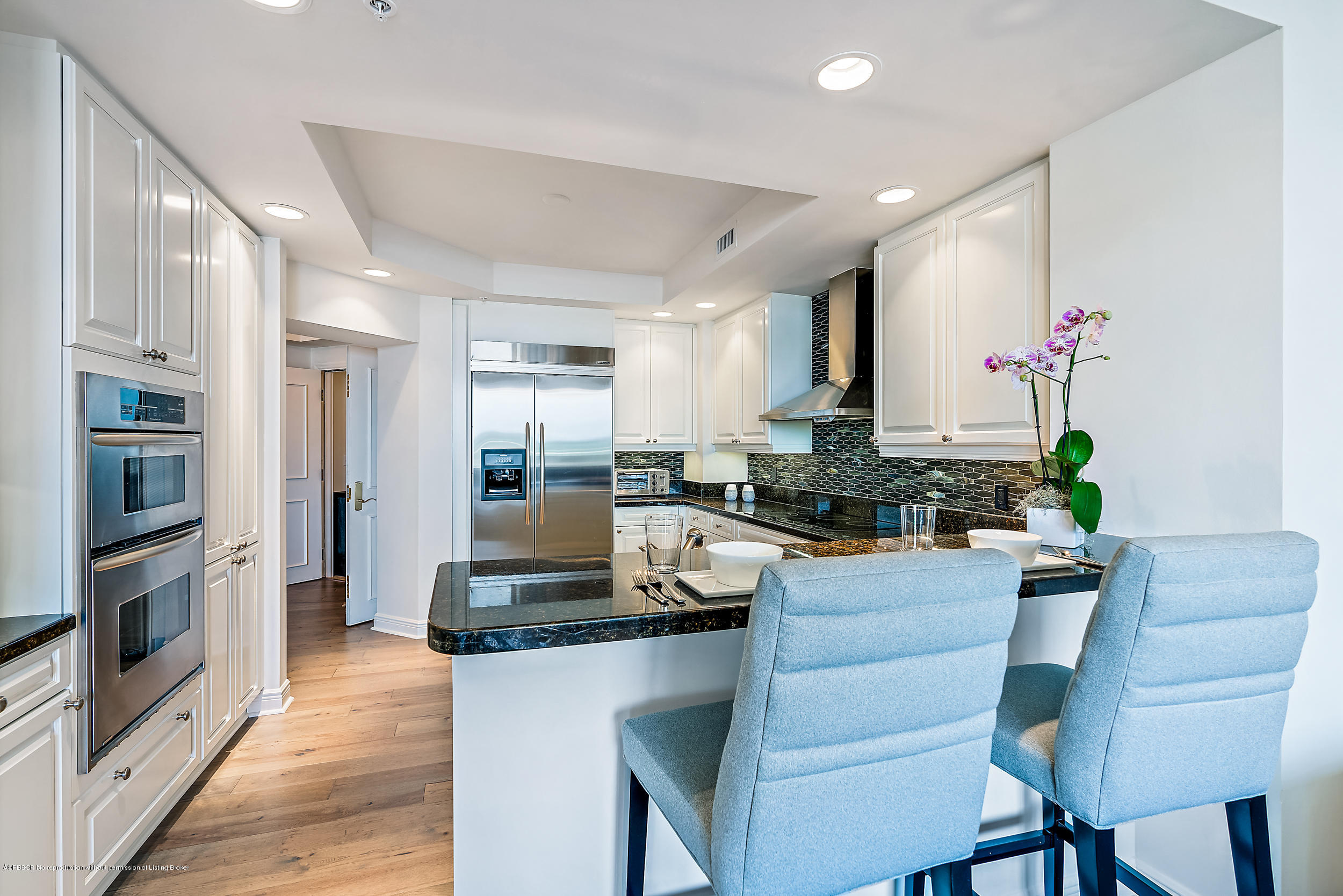 700 Highway 1, Unit 102 Jupiter, FL 33477 - Photo 10 of 36 a kitchen with granite countertop counter top space a sink appliances and cabinets