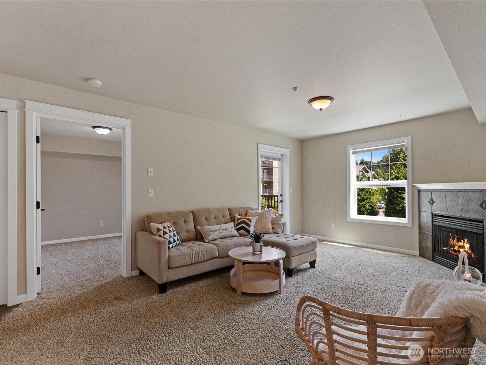 690 32nd Street, Unit B205 Bellingham, WA 98225 - Photo 15 of 40 a living room with furniture and a fireplace