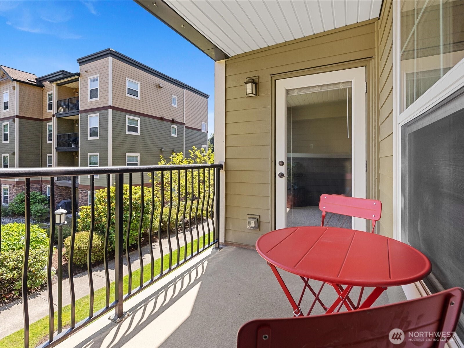 690 32nd Street, Unit B205 Bellingham, WA 98225 - Photo 2 of 40 a view of a balcony with a table and chairs