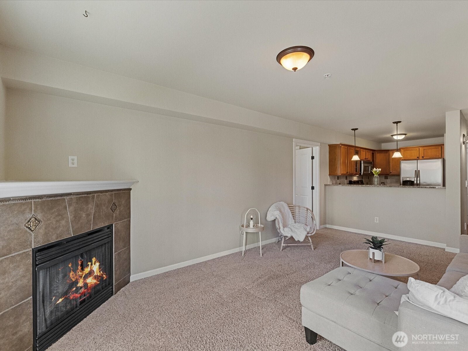 690 32nd Street, Unit B205 Bellingham, WA 98225 - Photo 31 of 40 a living room with furniture and a fireplace