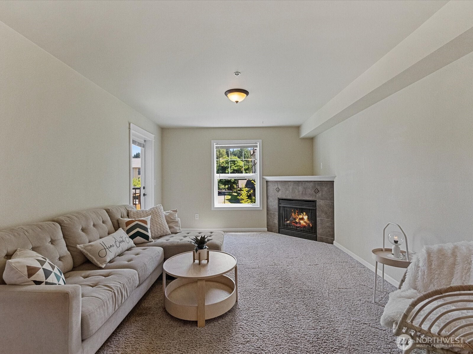 690 32nd Street, Unit B205 Bellingham, WA 98225 - Photo 32 of 40 a living room with furniture a fireplace and a window