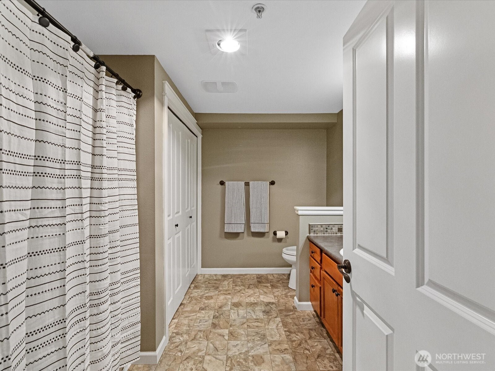 690 32nd Street, Unit B205 Bellingham, WA 98225 - Photo 34 of 40 a bathroom with a sink and mirror