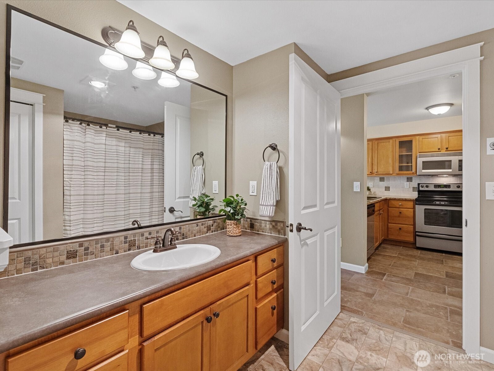 690 32nd Street, Unit B205 Bellingham, WA 98225 - Photo 37 of 40 a bathroom with a sink double vanity and a mirror